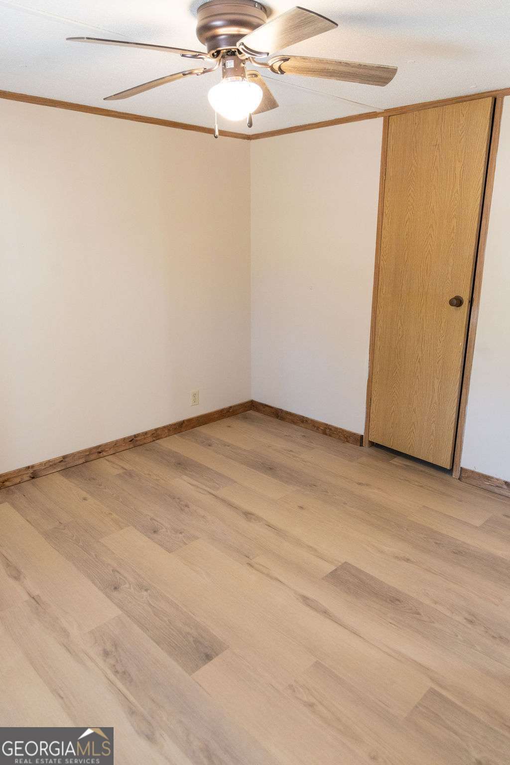 629 Sierra Road Jesup, GA 31545 - Photo 13 of 23 a view of a room with wooden floor