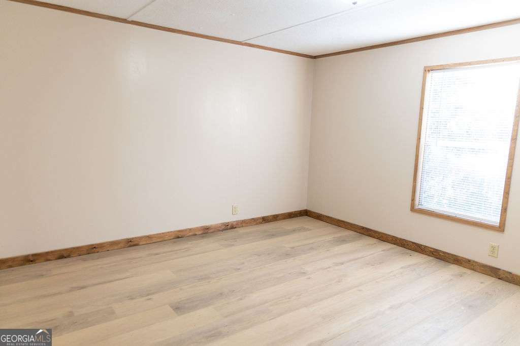 629 Sierra Road Jesup, GA 31545 - Photo 14 of 23 a view of an empty room with a window
