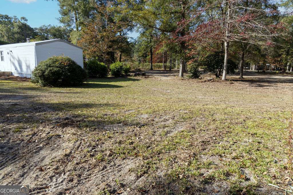 629 Sierra Road Jesup, GA 31545 - Photo 22 of 23 a view of patio with a yard