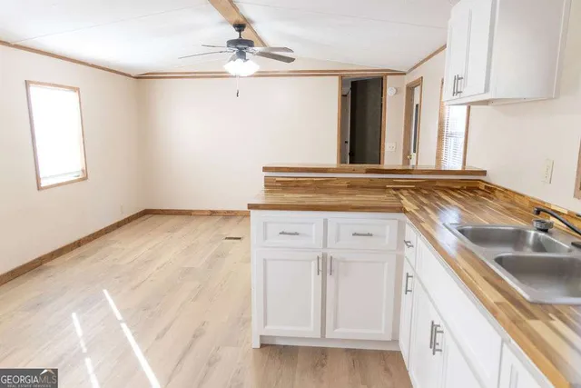 a view of a kitchen with cabinets