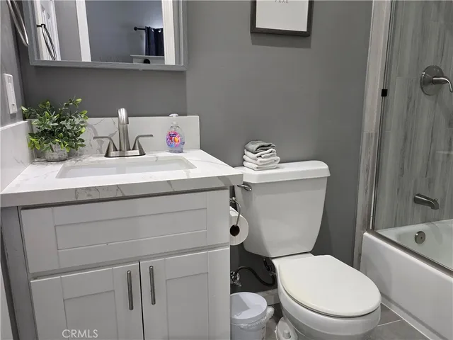 a bathroom with a bathtub and shower