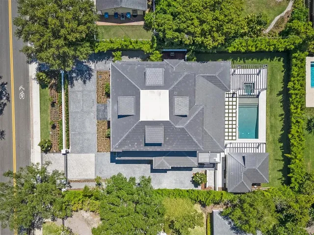 an aerial view of a house with a garden