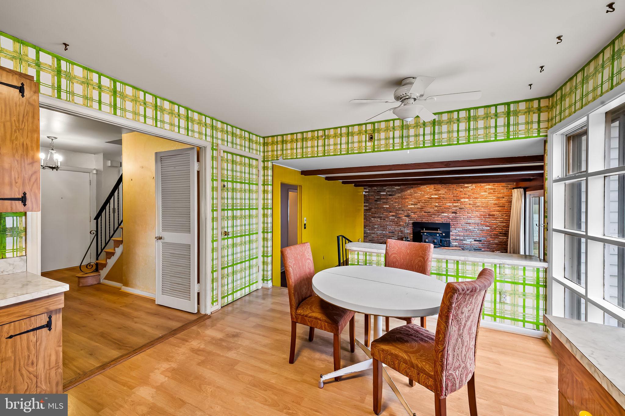 10 Geier Court Randallstown, MD 21133 - Photo 12 of 35 a view of a dining room with furniture window and wooden floor