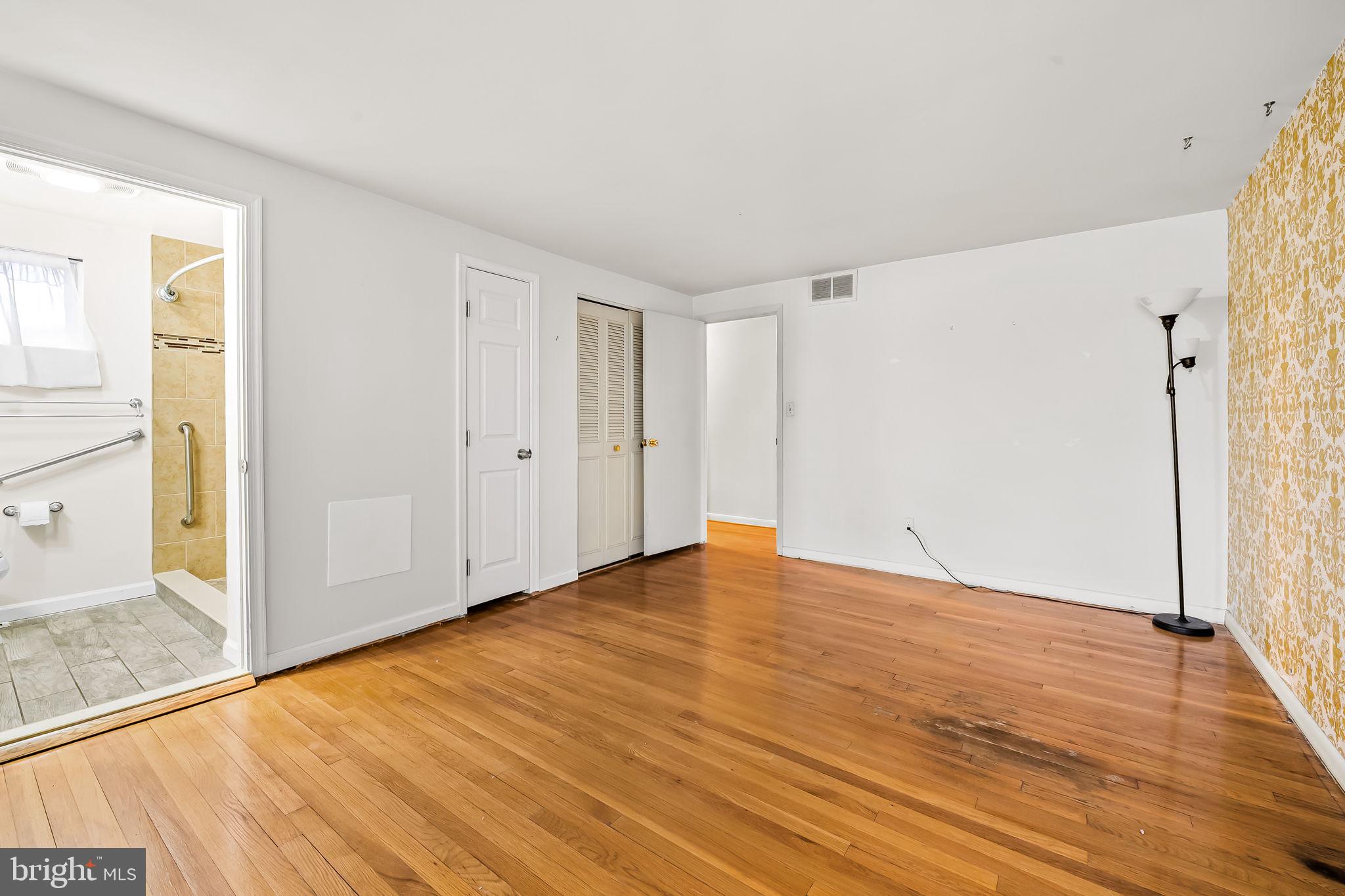 10 Geier Court Randallstown, MD 21133 - Photo 22 of 35 a view of empty room with wooden floor and fan