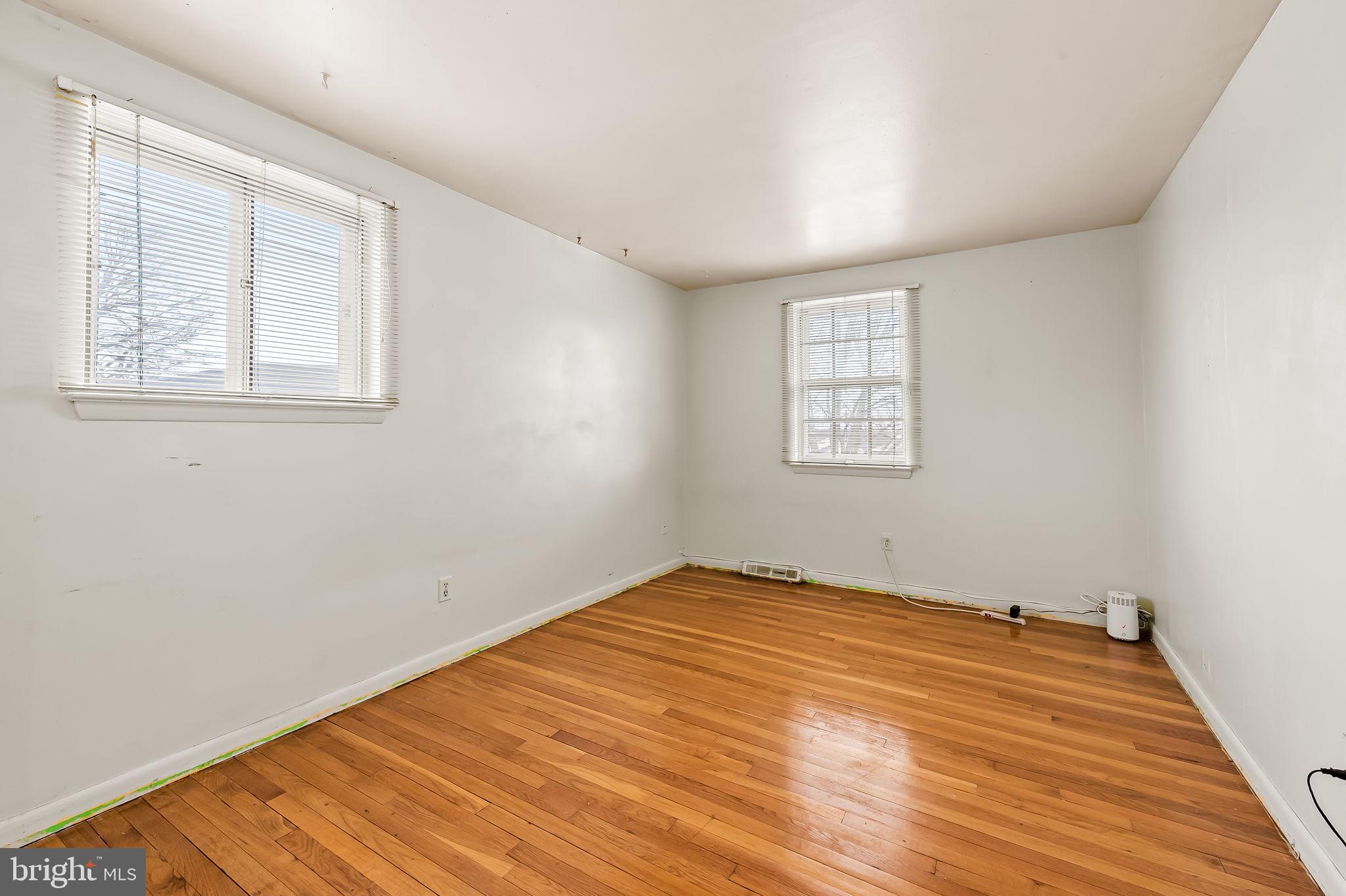 10 Geier Court Randallstown, MD 21133 - Photo 26 of 35 a view of empty room with wooden floor and fan