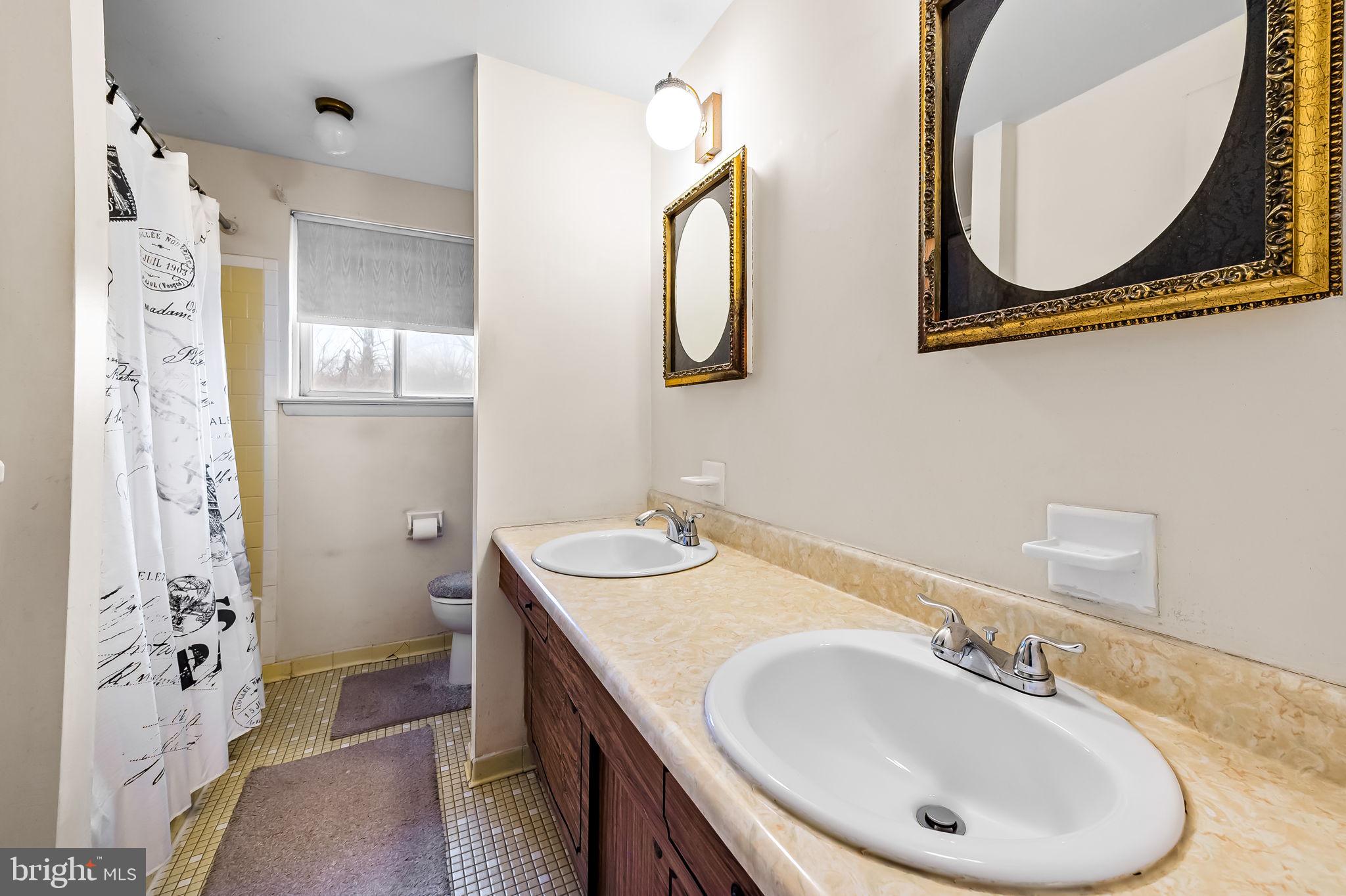 10 Geier Court Randallstown, MD 21133 - Photo 31 of 35 a bathroom with a sink and a mirror