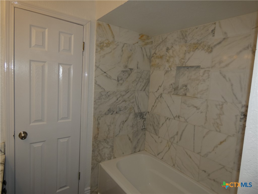 14745 Babcock Road San Antonio, TX 78249 - Photo 16 of 25 a bathroom with a bathtub