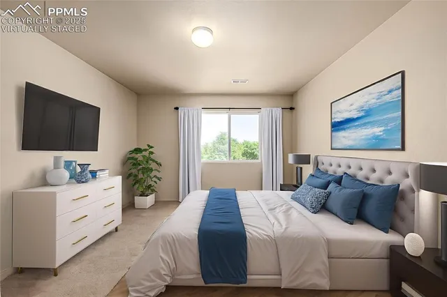 a bedroom with a bed and window