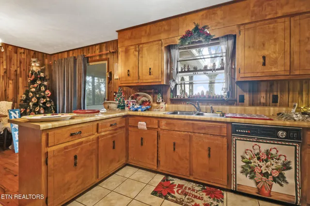 a bathroom with a granite countertop sink and a toilet