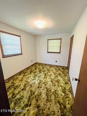 a view of balcony with wooden floor