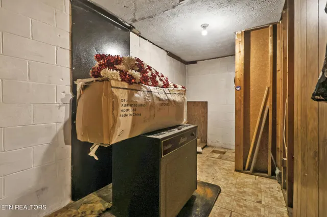 a view of a golf ground with huge green field and covered with tall trees