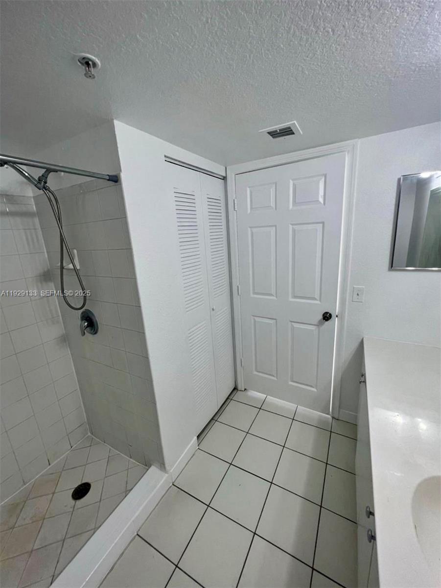 15440 Southwest 284th Street, Unit 5307 Homestead, FL 33033 - Photo 14 of 25 a bathroom with a shower and toilet