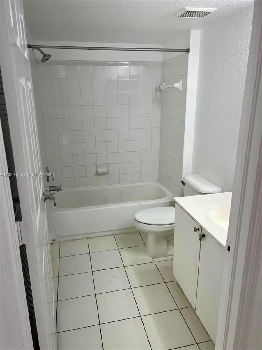 15440 Southwest 284th Street, Unit 5307 Homestead, FL 33033 - Photo 15 of 25 a bathroom with a bathtub a toilet and a shower