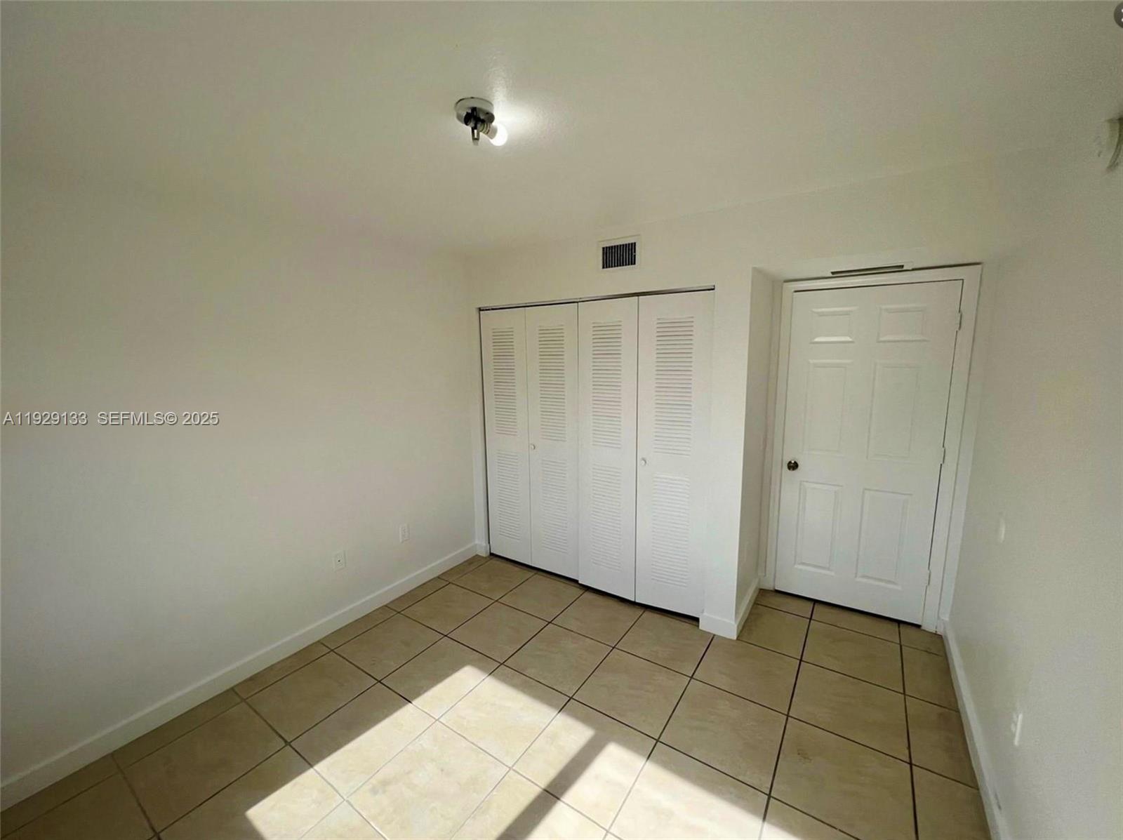 15440 Southwest 284th Street, Unit 5307 Homestead, FL 33033 - Photo 17 of 25 a view of an empty room