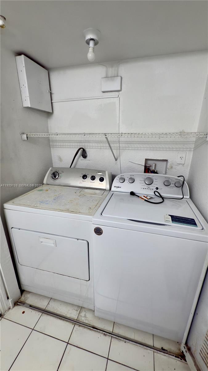 15440 Southwest 284th Street, Unit 5307 Homestead, FL 33033 - Photo 19 of 25 a utility room with dryer and washer