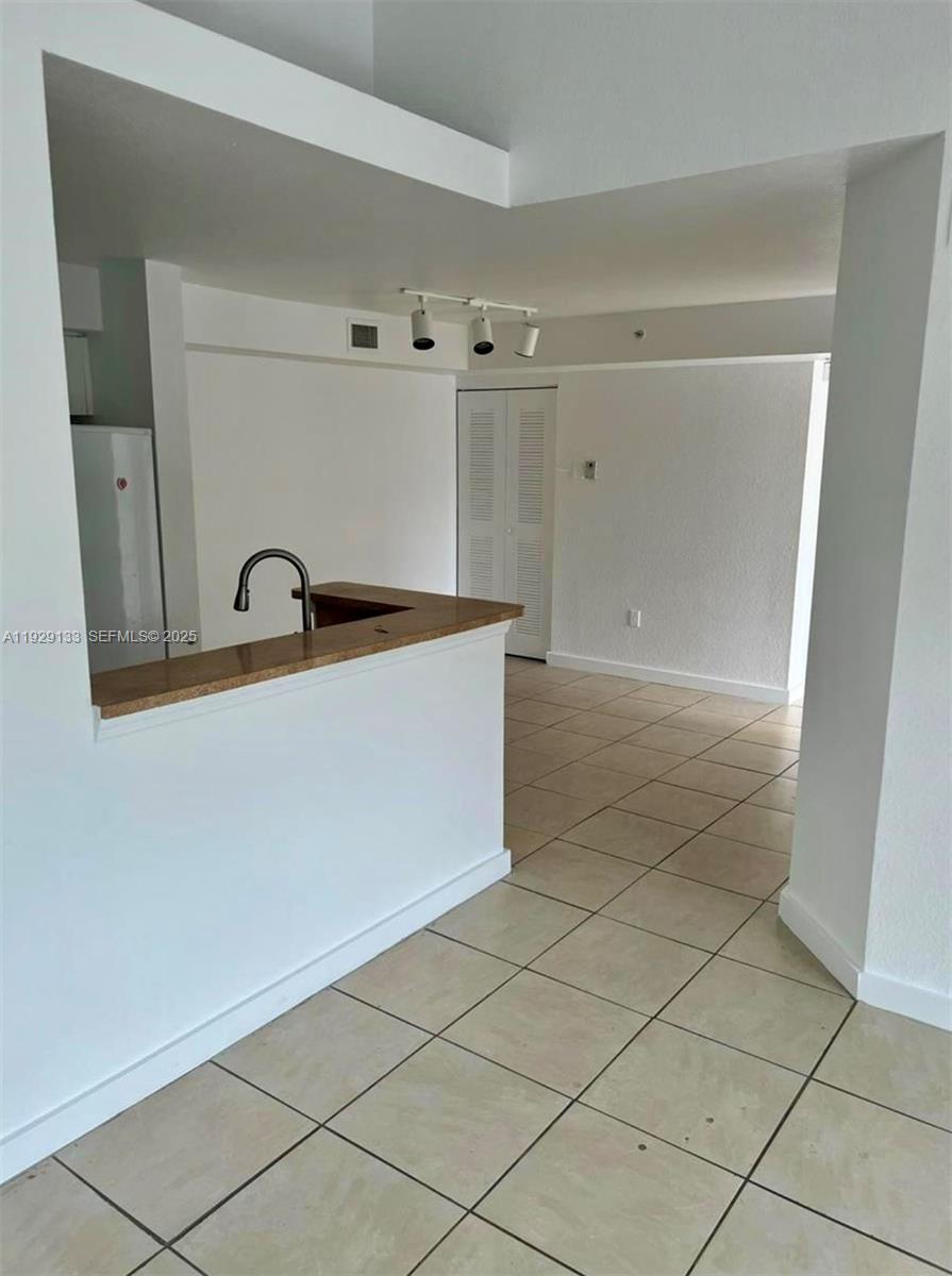 15440 Southwest 284th Street, Unit 5307 Homestead, FL 33033 - Photo 2 of 25 a bathroom with a sink and a mirror