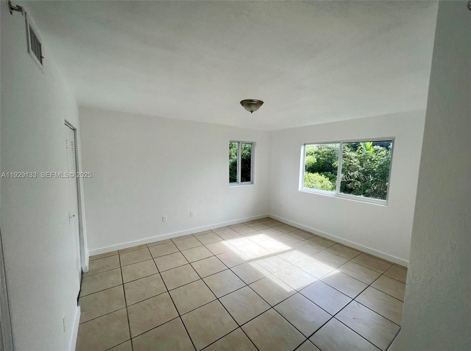 15440 Southwest 284th Street, Unit 5307 Homestead, FL 33033 - Photo 9 of 25 a view of an empty room and window