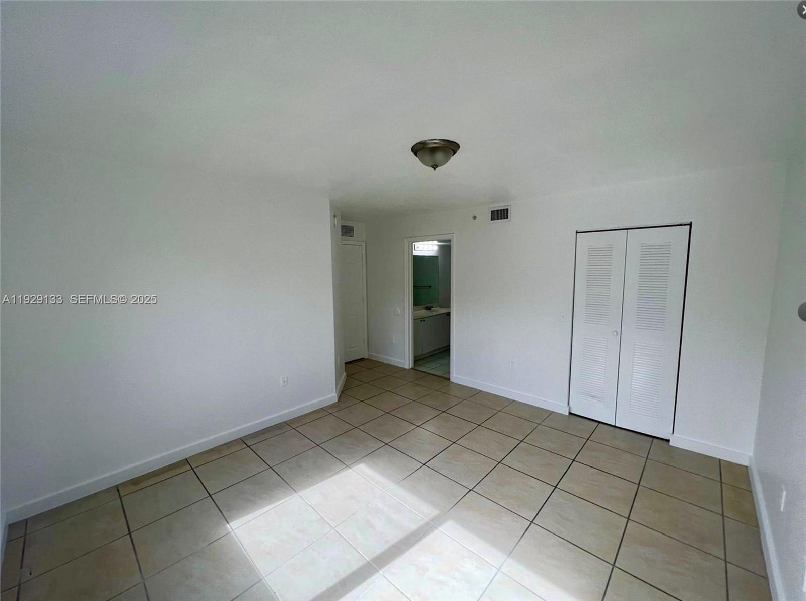 15440 Southwest 284th Street, Unit 5307 Homestead, FL 33033 - Photo 10 of 25 a view of an empty room with closet