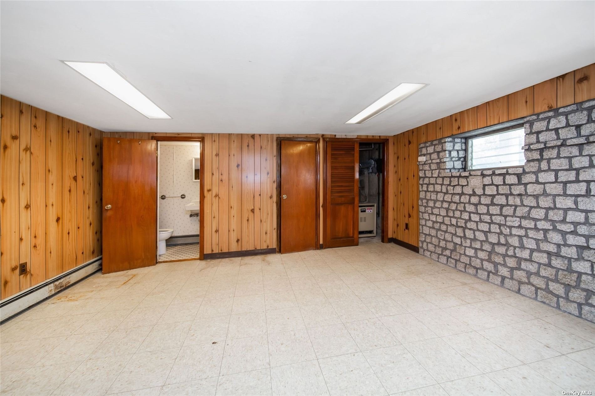 2-06 147th Place Queens, NY 11357 - Photo 14 of 21 a view of an empty room with a window