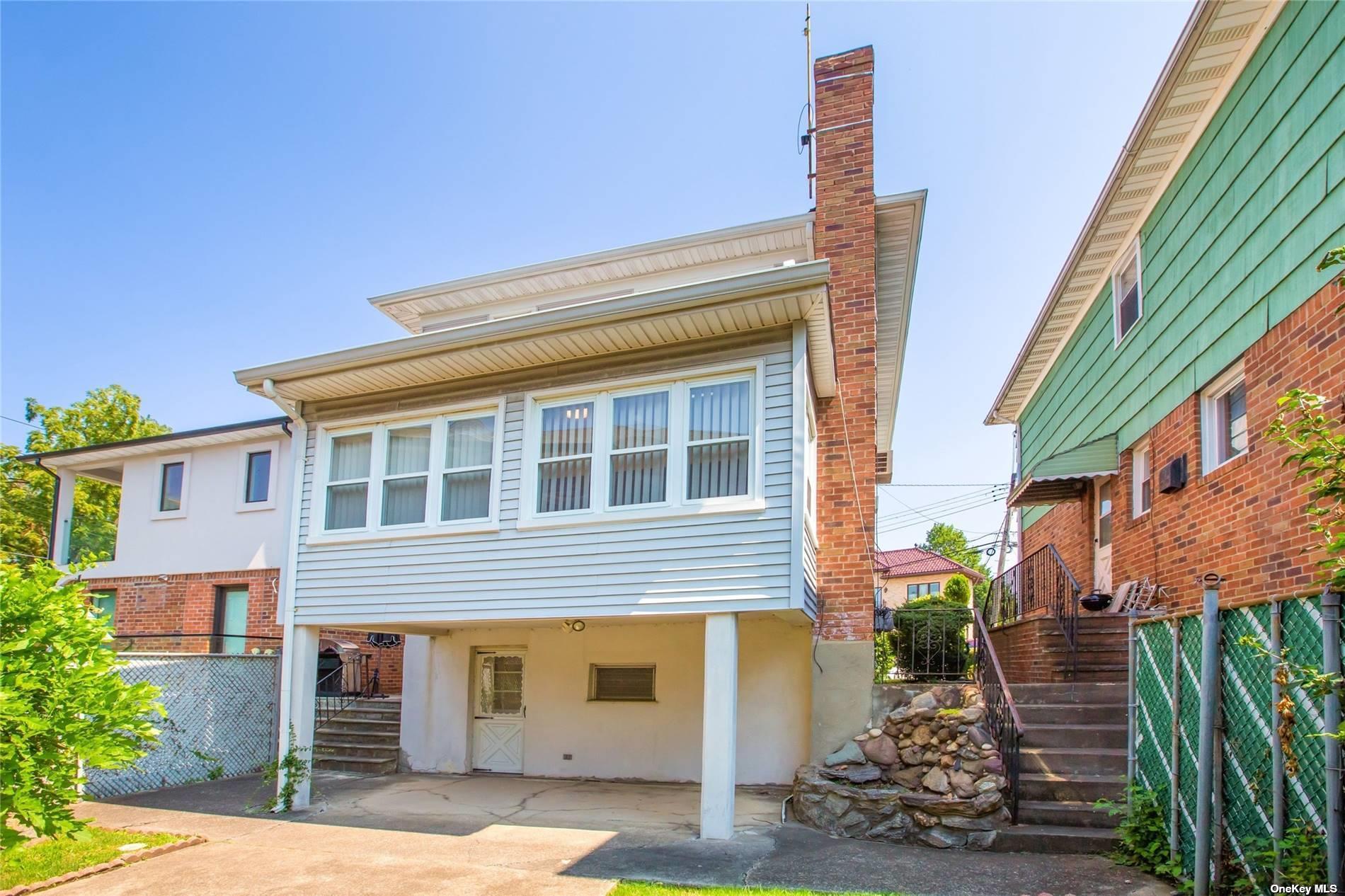 2-06 147th Place Queens, NY 11357 - Photo 16 of 21 a front view of a building