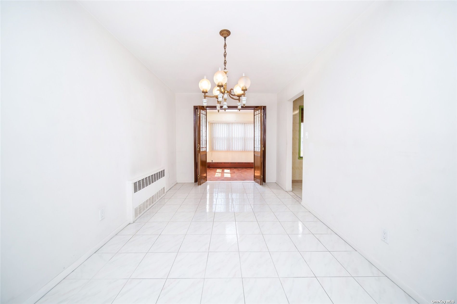 2-06 147th Place Queens, NY 11357 - Photo 8 of 21 a view of a chandelier in a hallway