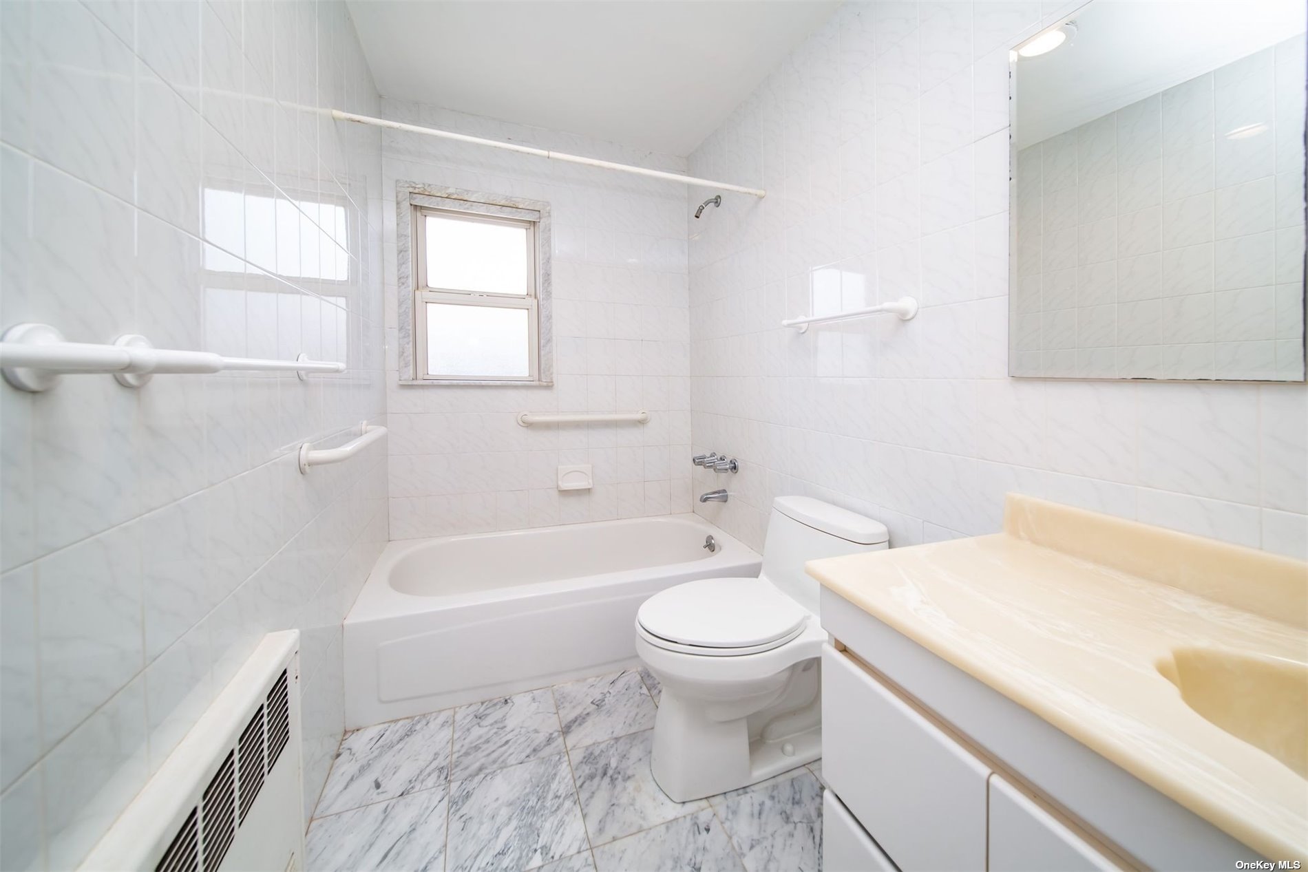 2-06 147th Place Queens, NY 11357 - Photo 9 of 21 a bathroom with a sink a toilet and a bathtub