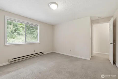 an empty room with a empty space and window