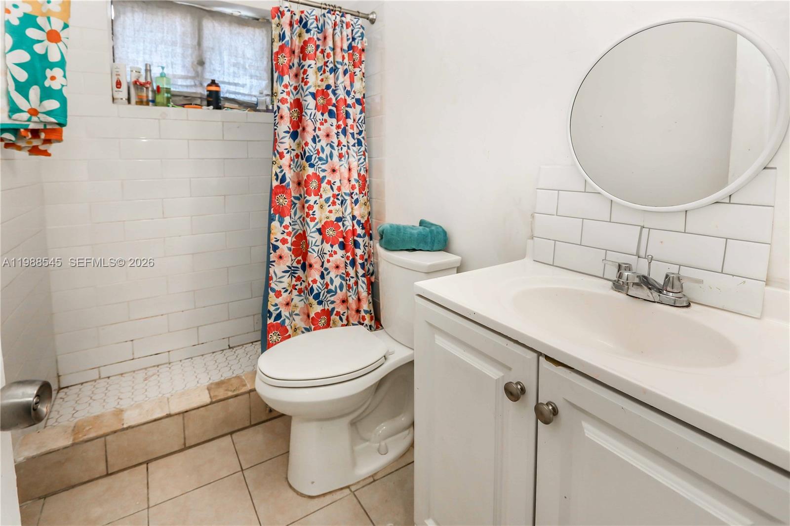 528 East 10th Street Hialeah, FL 33010 - Photo 12 of 13 a bathroom with a sink toilet and shower