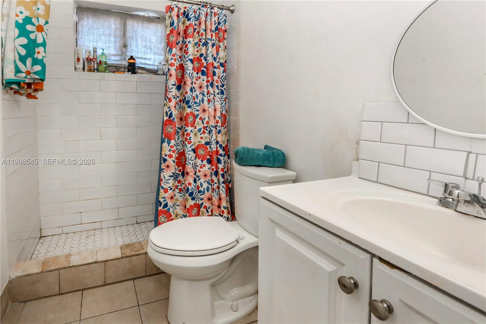 528 East 10th Street Hialeah, FL 33010 - Photo 13 of 13 a bathroom with a sink toilet and shower