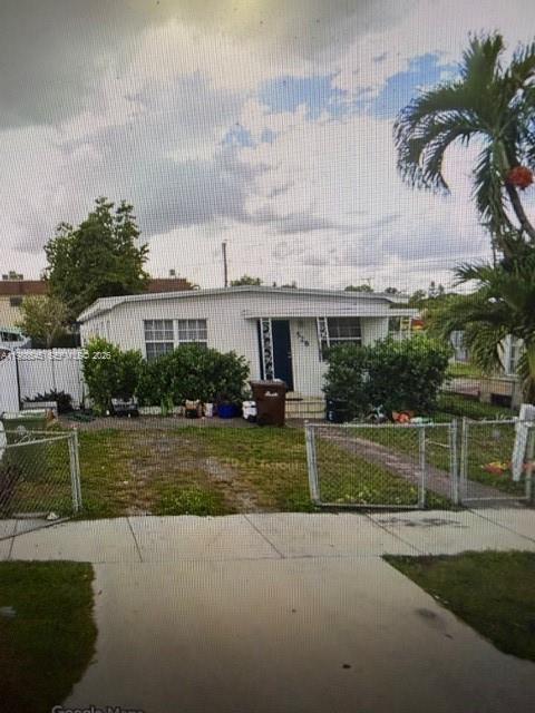 528 East 10th Street Hialeah, FL 33010 - Photo 3 of 13 a front view of house with yard and green space