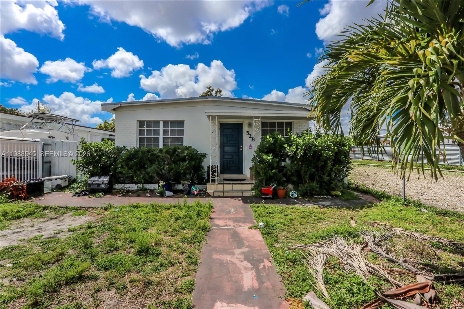 528 East 10th Street Hialeah, FL 33010 - Photo 4 of 13 a view of a house with a yard