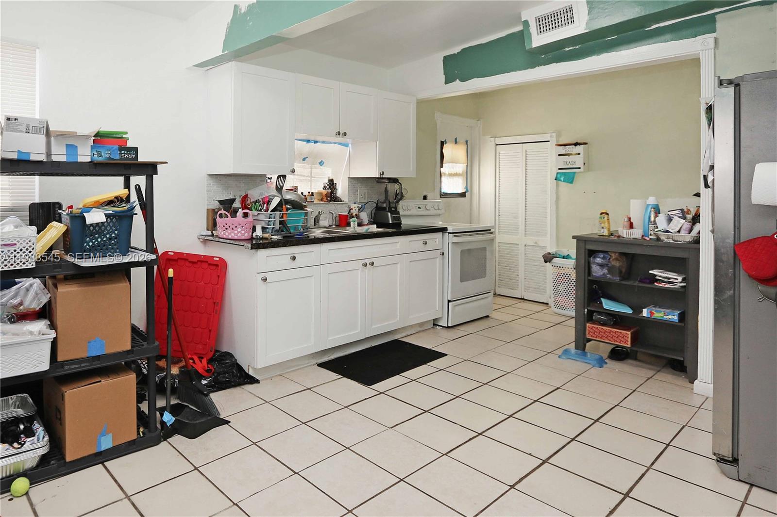 528 East 10th Street Hialeah, FL 33010 - Photo 7 of 13 a room with storage and utility