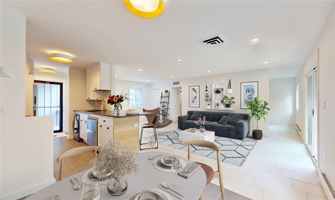 95 Sterling Street, Unit 95 Beacon, NY 12508 - Photo 1 of 1 a living room with furniture and kitchen view