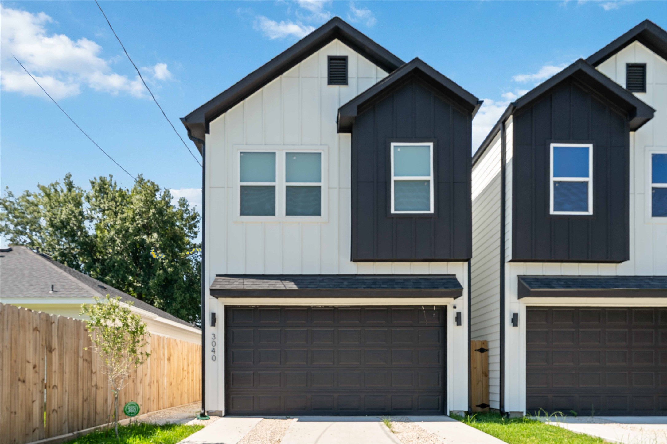 3040 Webster Street Houston, TX 77004 - Photo 1 of 18 a front view of a house with a garage