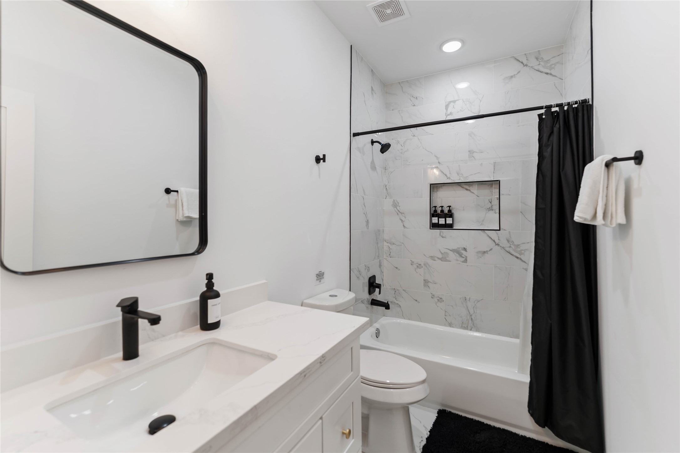3040 Webster Street Houston, TX 77004 - Photo 16 of 18 a bathroom with a sink a toilet and shower
