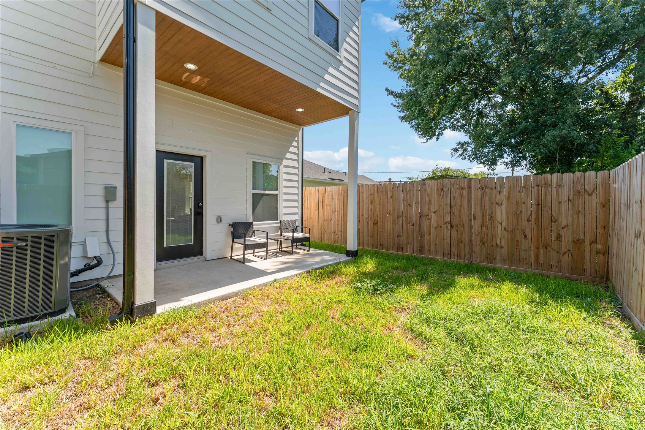 3040 Webster Street Houston, TX 77004 - Photo 17 of 18 a view of swimming pool with lawn chairs and wooden fence