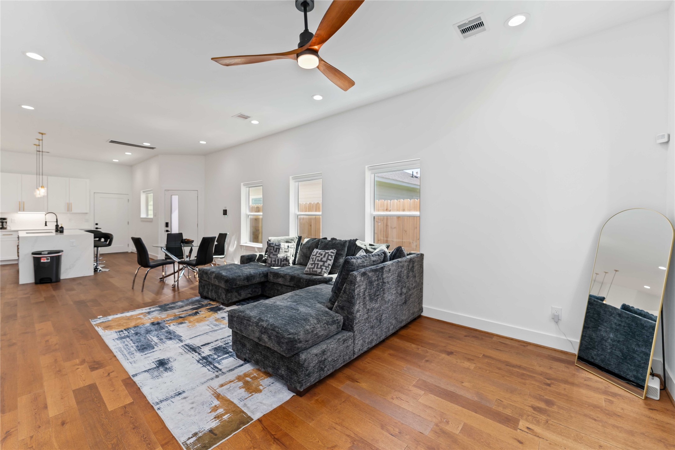 3040 Webster Street Houston, TX 77004 - Photo 4 of 18 a living room with furniture a couch and wooden floor