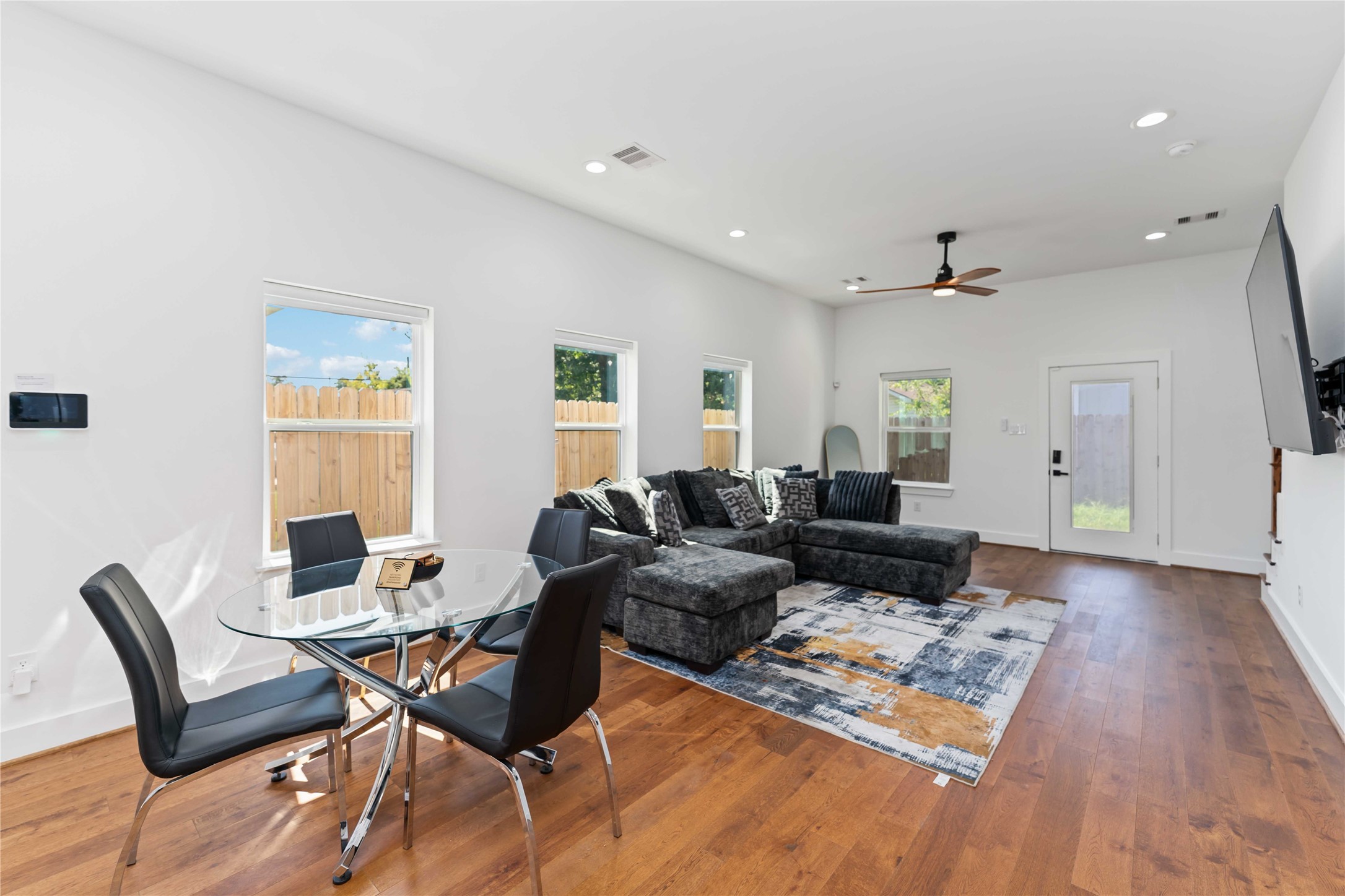 3040 Webster Street Houston, TX 77004 - Photo 5 of 18 a living room with furniture and wooden floor