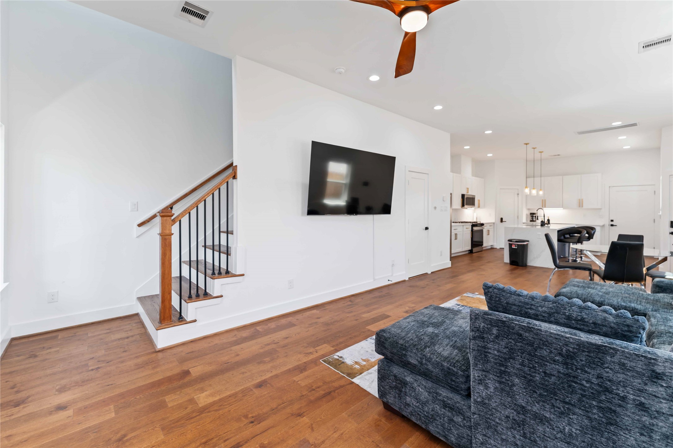3040 Webster Street Houston, TX 77004 - Photo 6 of 18 a living room with furniture and a flat screen tv