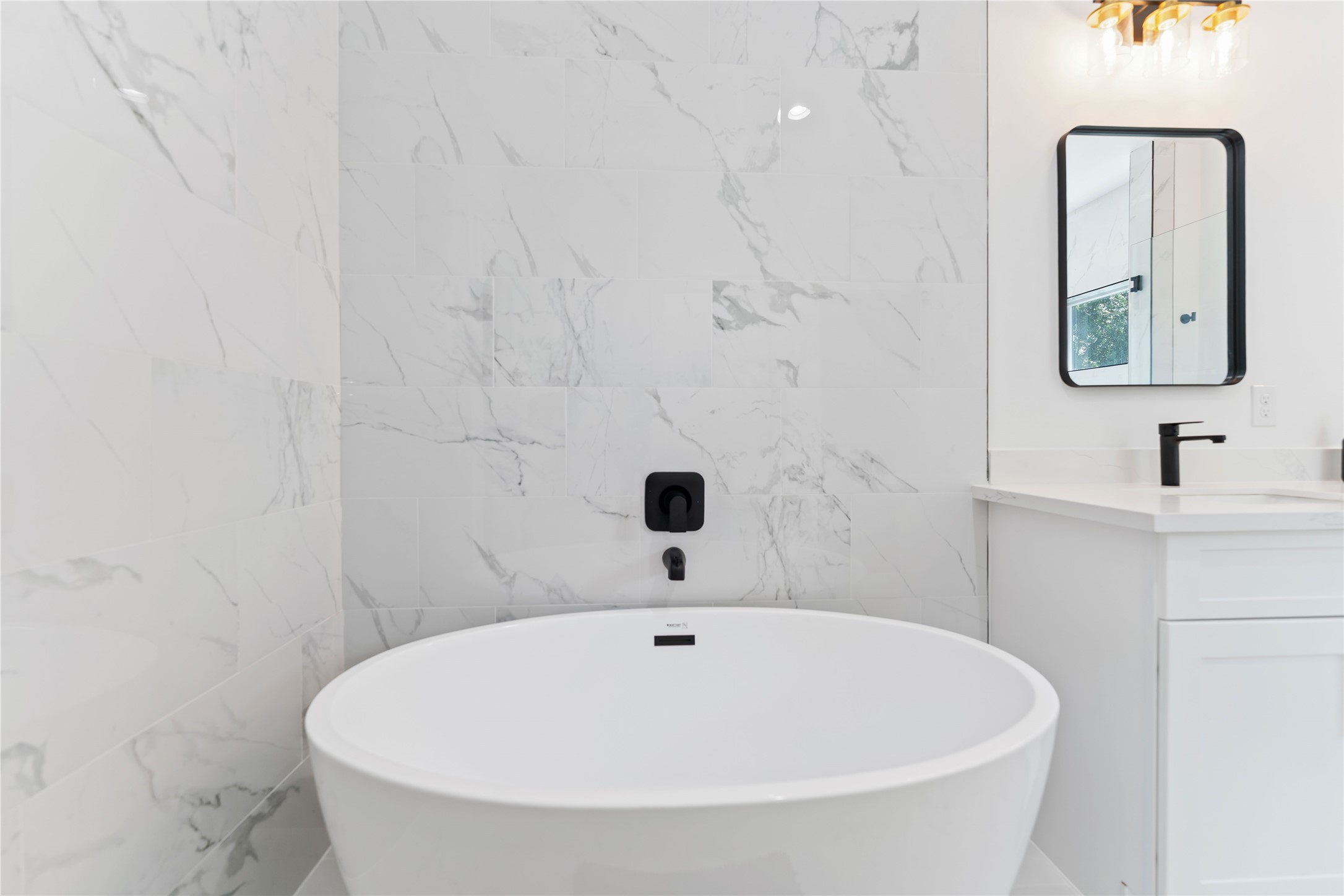 3040 Webster Street Houston, TX 77004 - Photo 10 of 18 a bathroom with a sink and a mirror