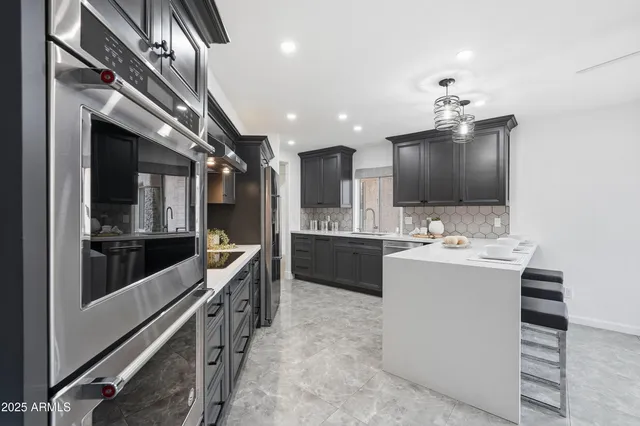 a kitchen with a sink and cabinets