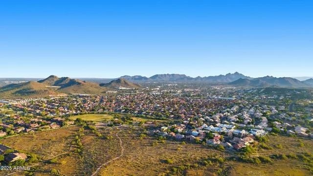 a view of a city with mountains in the background