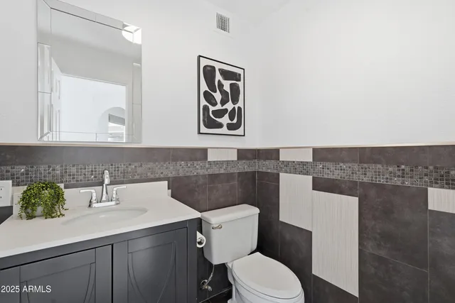 a bathroom with a sink double vanity and a mirror