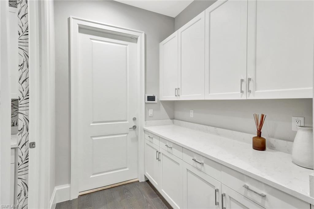 16340 Corsica Way, Unit 101 Naples, FL 34110 - Photo 36 of 48 Entry from Garage