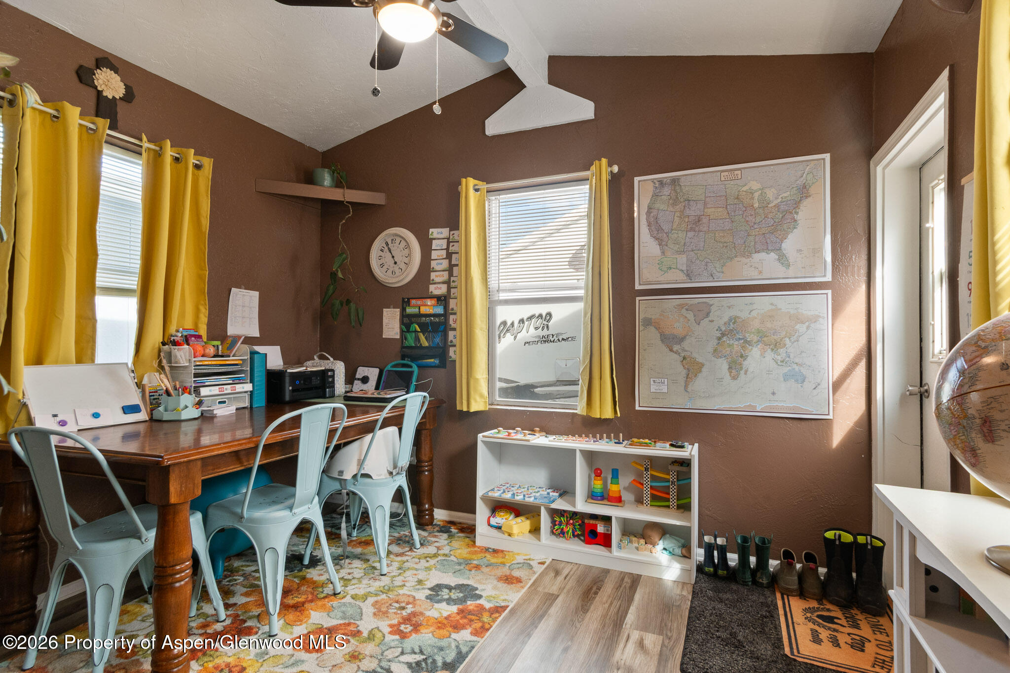 106 Cedar Circle Parachute, CO 81635 - Photo 25 of 35 a view of a dining room with furniture window and wooden floor