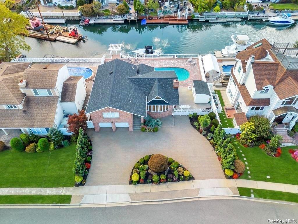 an aerial view of a house with a lake view