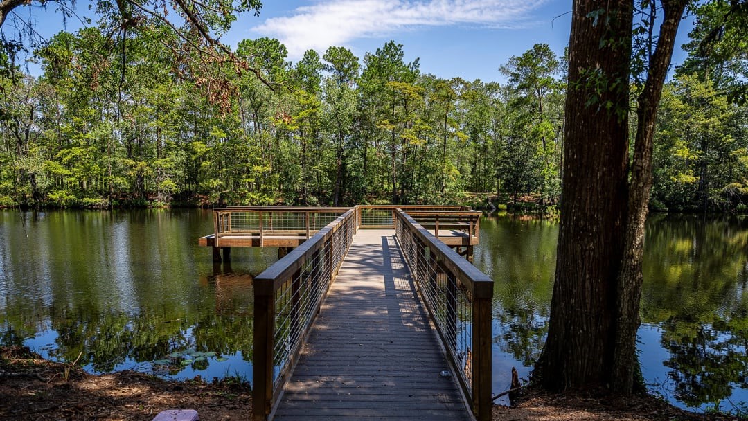9640 Mount Brewer Lane Porter, TX 77365 - Photo 14 of 14 a view of a balcony with wooden floor and lake view