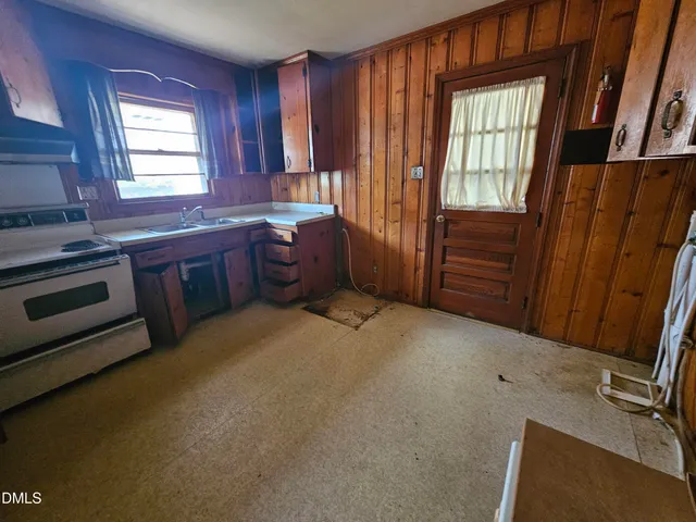 wooden floor and window in an empty room