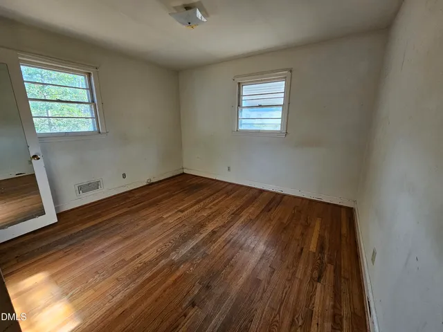 an empty room with windows