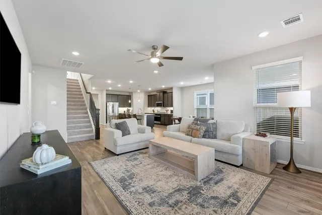 a living room with furniture or couch and a flat screen tv